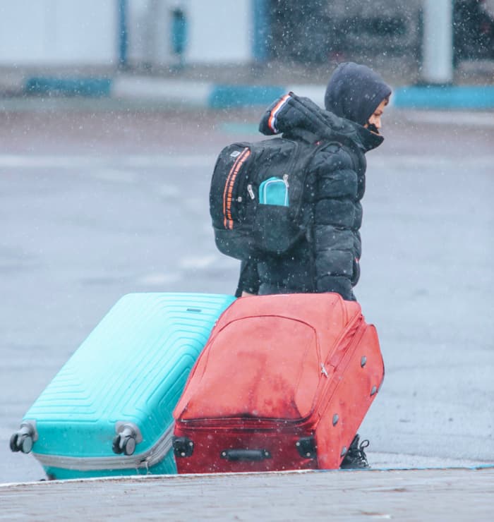 boy with suitcases